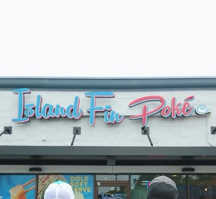 Island Fin Poké storefront sign during the NIL Guru in-store activation